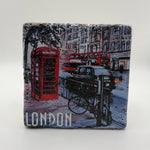 Phone box and black cab artwork printed on square travertine stone coaster