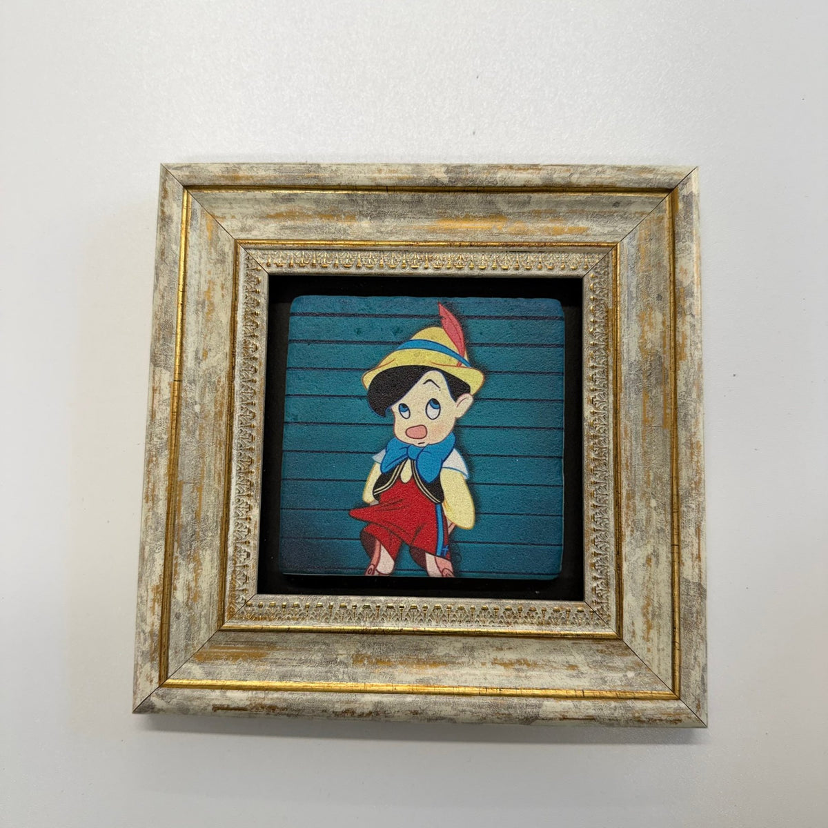 Variant Mapping v4 | pinocchio-natural-stone-coaster | with Gold Frame | sha256:4ea7e099ce05