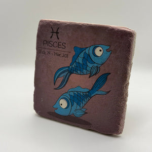 Pisces zodiac symbol printed on square travertine stone coaster