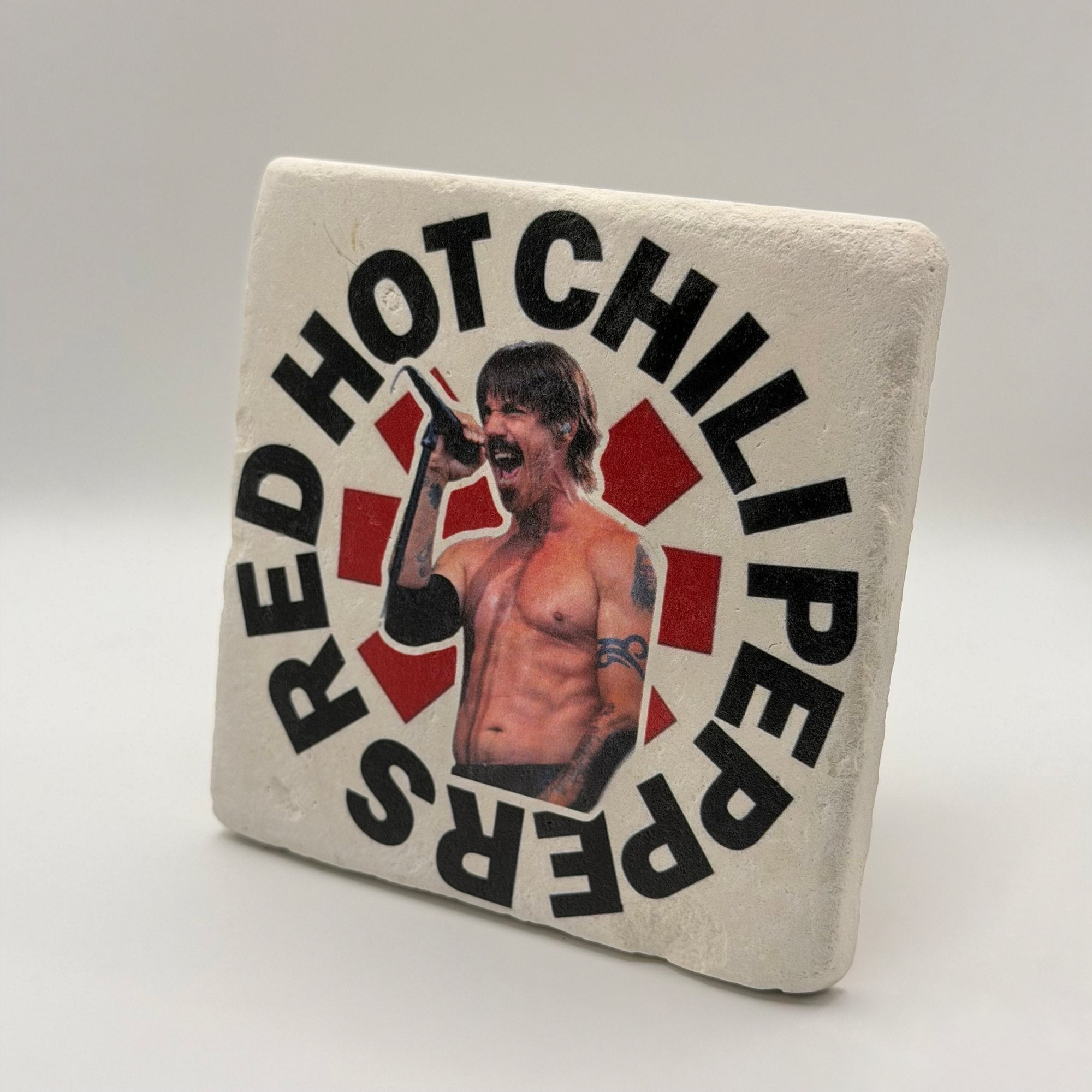Red Hot Chili Peppers artwork printed on square travertine stone coaster