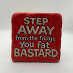 Funny slogan 'Step Away from the Fridge, You Fat Bastard' printed on square travertine stone coaster