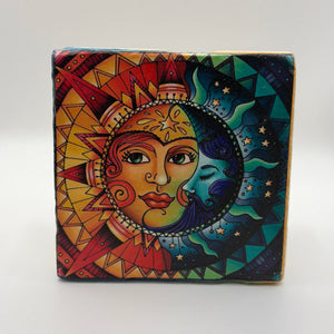 Cosmic design featuring sun and moon printed on square travertine stone coaster