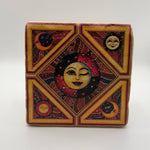 Yellow sun and moon artwork printed on square travertine stone coaster