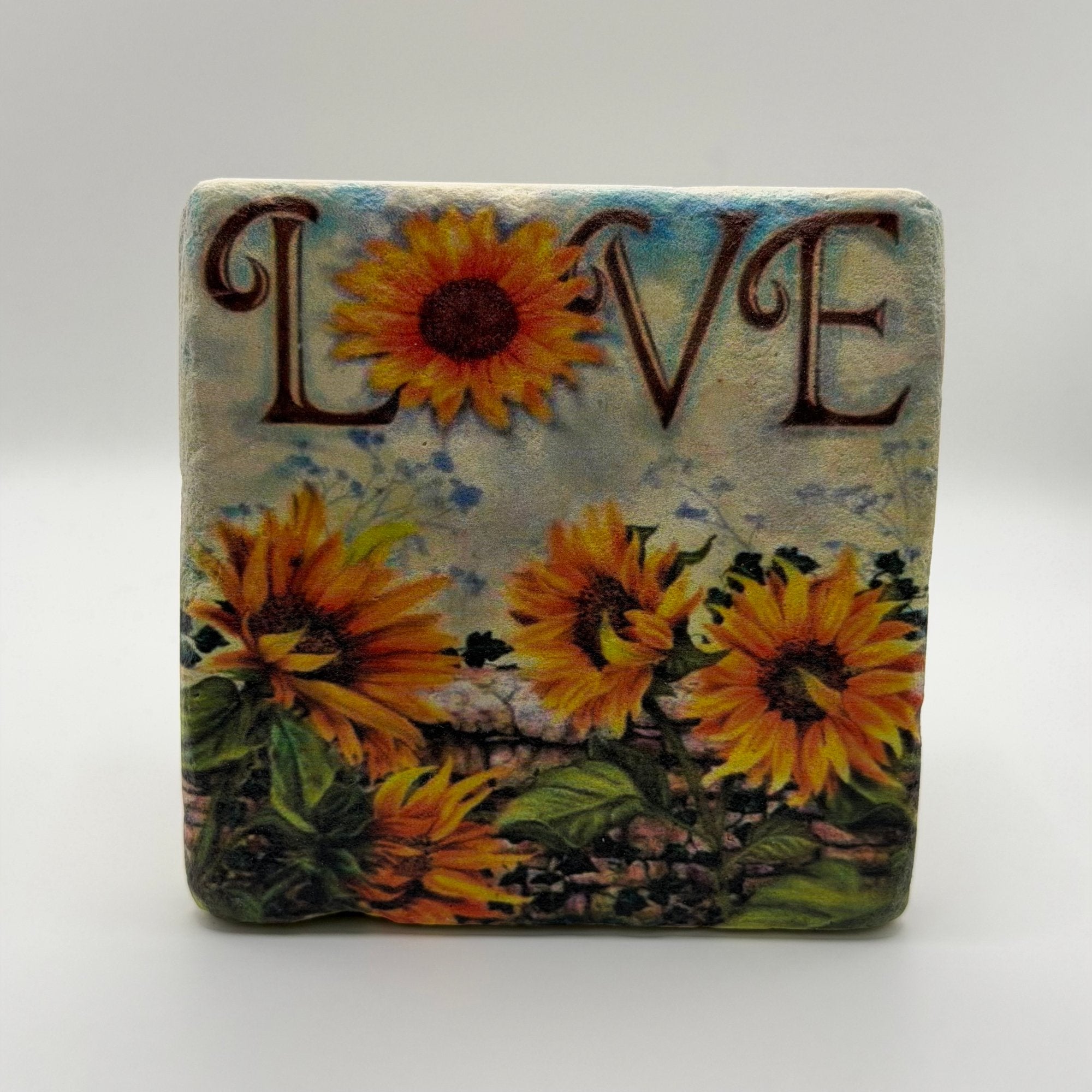 Vintage botanical illustration of sunflowers printed on square travertine stone coaster