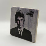 The Jam artwork printed on square travertine stone coaster
