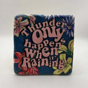 Funny quote about thunder printed on square travertine stone coaster