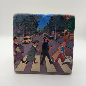 Tintin artwork featuring the Beatles' Abbey Road print on square travertine stone coaster