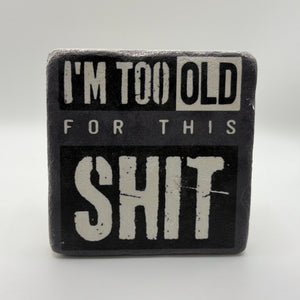 Im Too Old For This Shit slogan printed on square natural travertine stone coaster