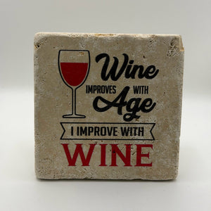 Wine improves with age quote printed on square natural travertine stone coaster