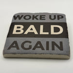 Woke Up Bald Again slogan printed on square travertine stone coaster