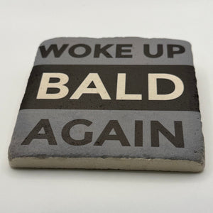 Woke Up Bald Again slogan printed on square travertine stone coaster